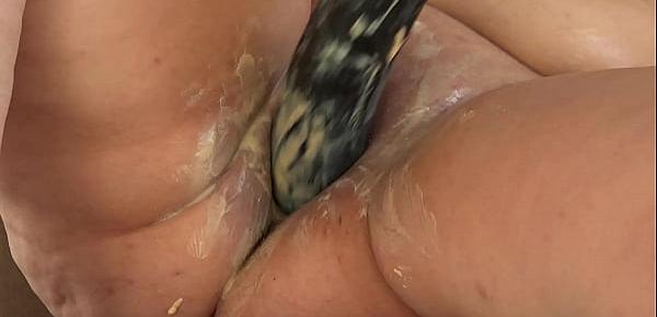  Mature BBW smears cream on her plump figure and masturbates with a huge black rubber dick on the table Homemade fetish and big shaved pussy